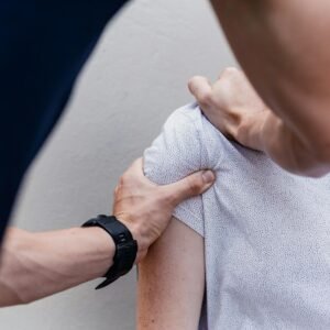 a woman holding onto a man's arm